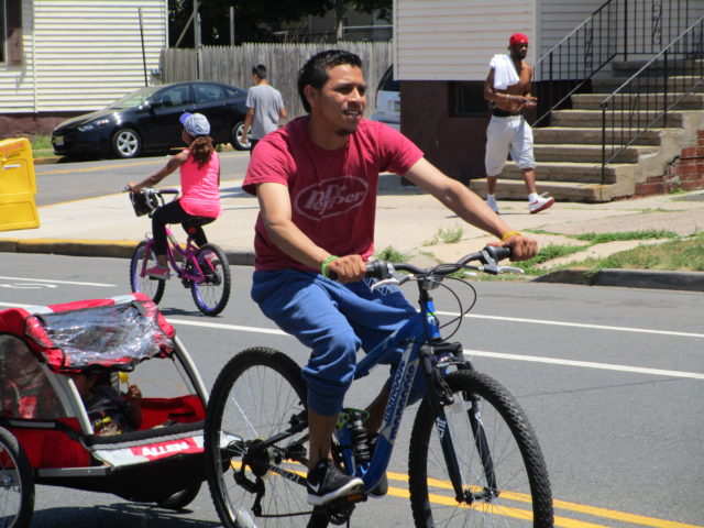 Latino man with bike trailer